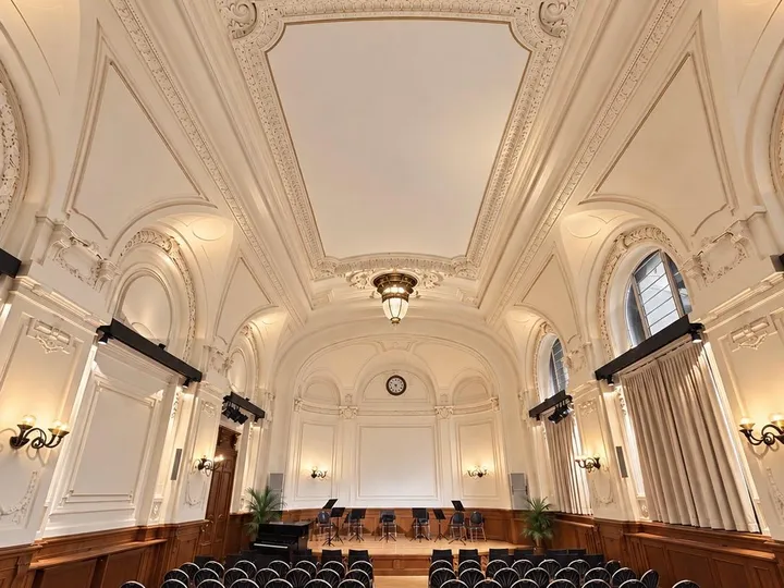 View across the rows of seats to the stage of the Albert Hall